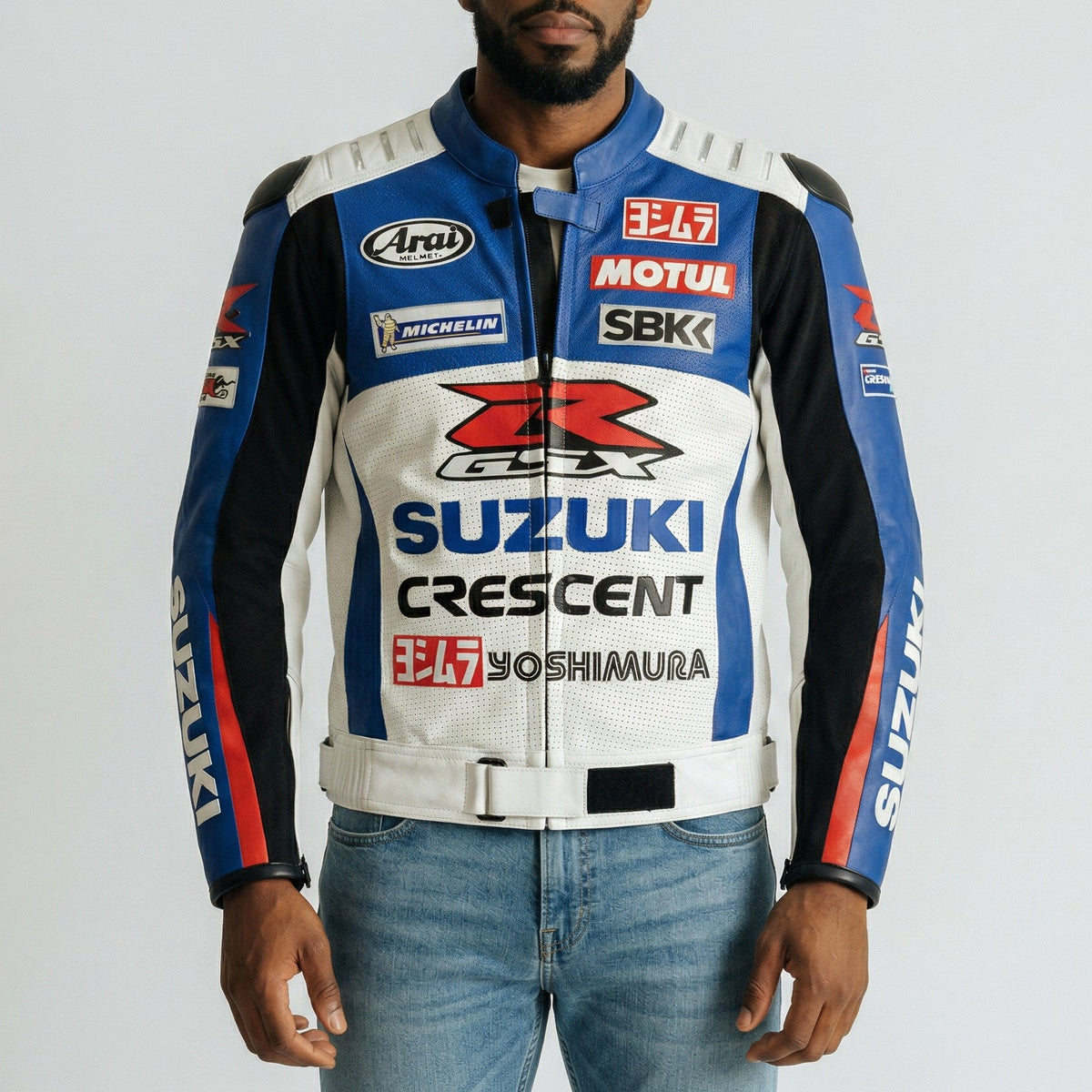 Man wearing a branded suzuki GSX-R motorcycle jacket with various logos on a plain background