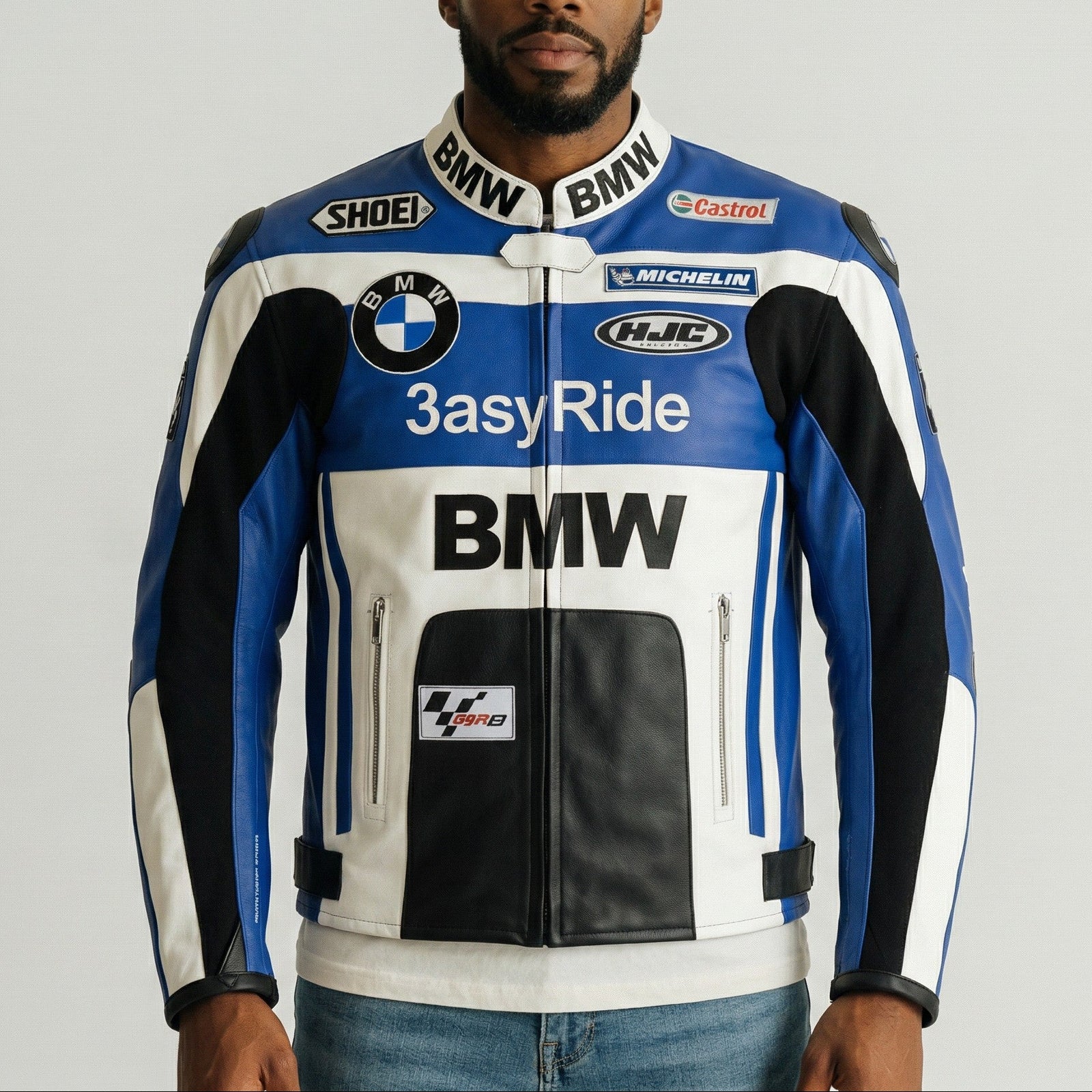 Man wearing a BMW branded motorcycle jacket on a plain background