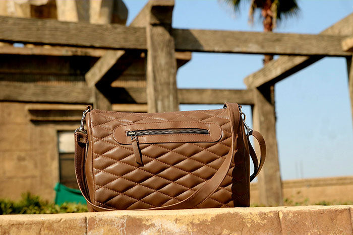 Ladies leather handbag, diamond cut shape bag