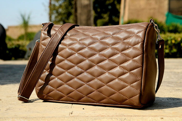 Ladies leather handbag, diamond cut shape bag