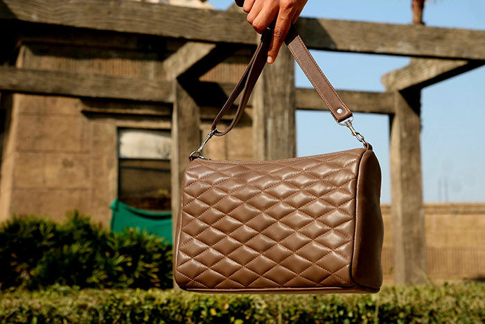 Ladies leather handbag, diamond cut shape bag
