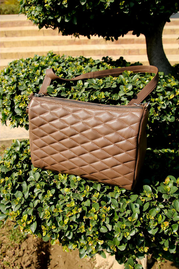 Ladies leather handbag, diamond cut shape bag