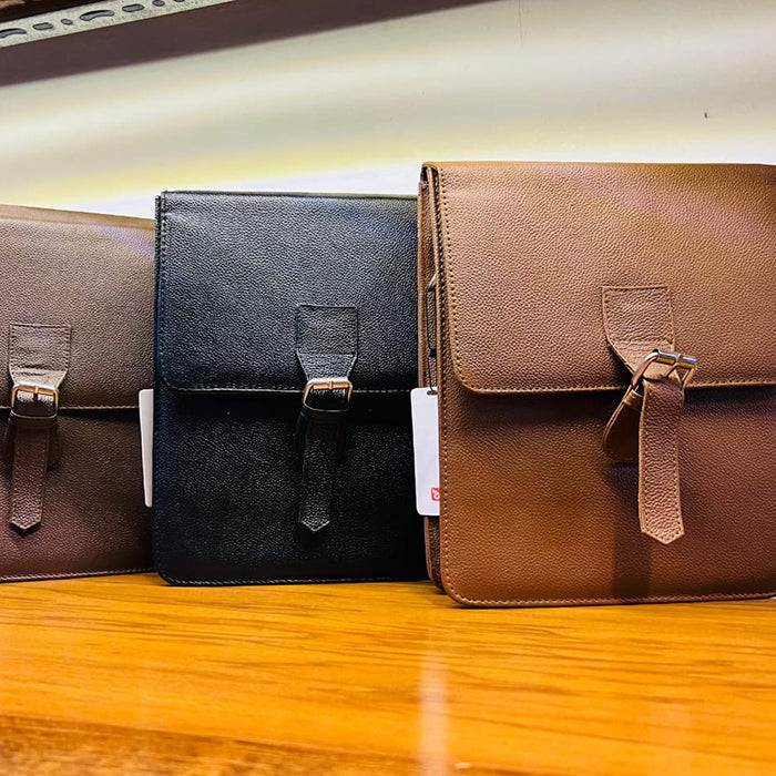 Three leather crossbody bags in black, brown, and a combination of both colors, displayed side by side.