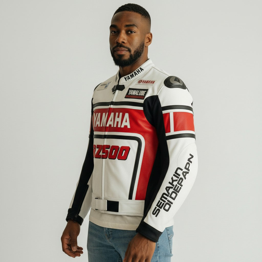 Man wearing a Yamaha rz500 motorcycle jacket on a plain background