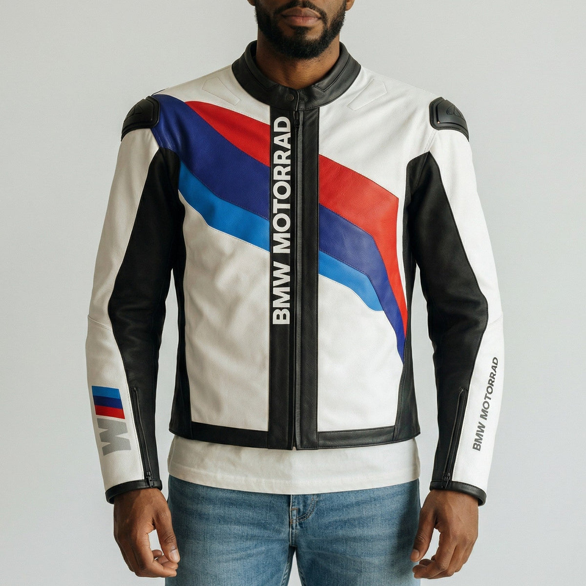 Man wearing a BMW Motorrad jacket with a gray background