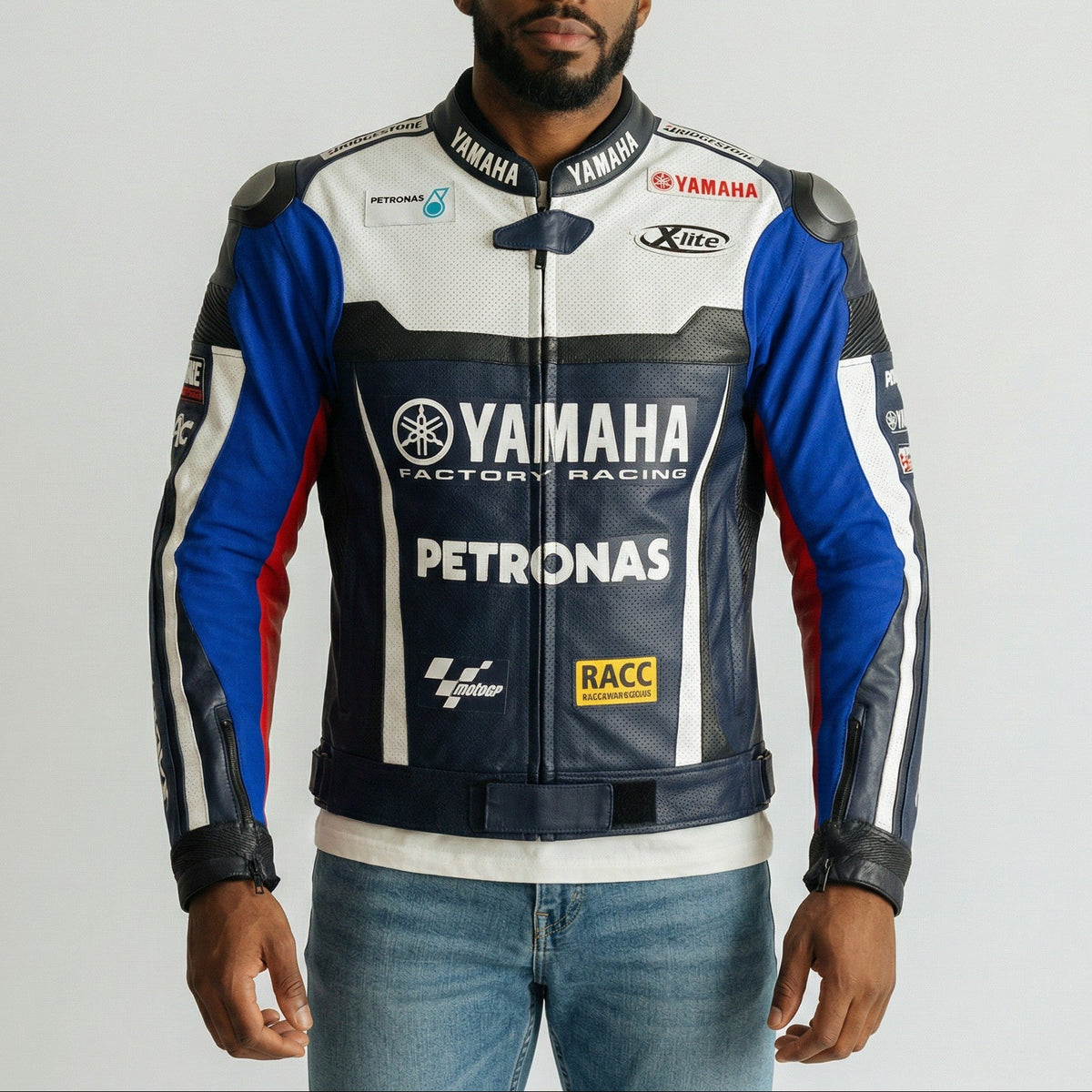 Man wearing a Yamaha Petronas racing jacket on a plain background