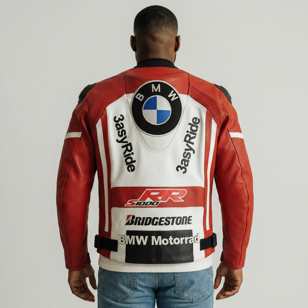 Person wearing a red and white motorcycle jacket with various brand logos on a plain background