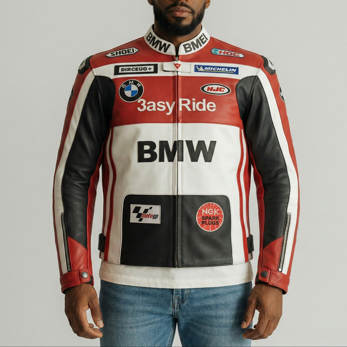 Man wearing a BMW branded motorcycle jacket on a plain background
