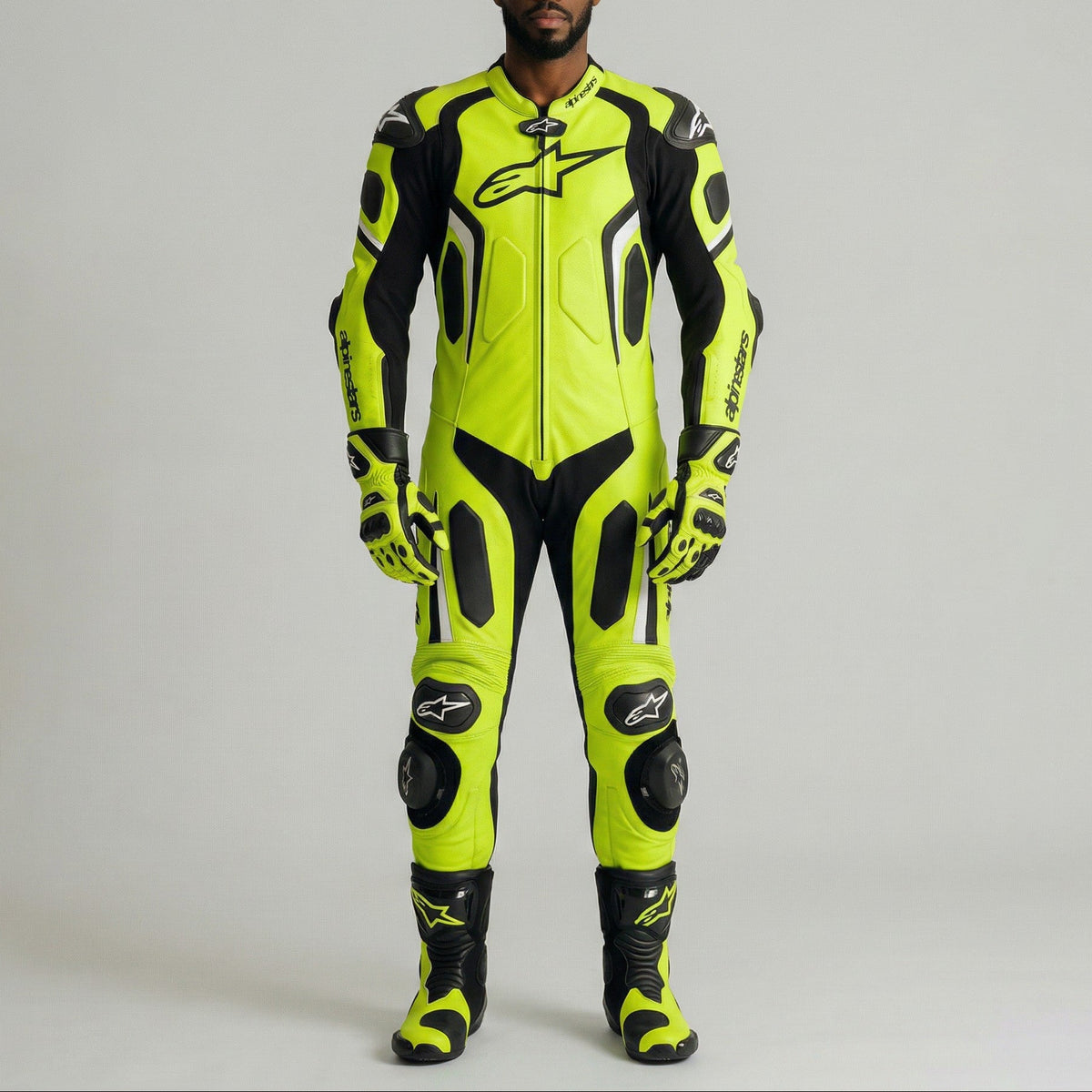 Person wearing a bright yellow and black motorcycle racing suit on a gray background